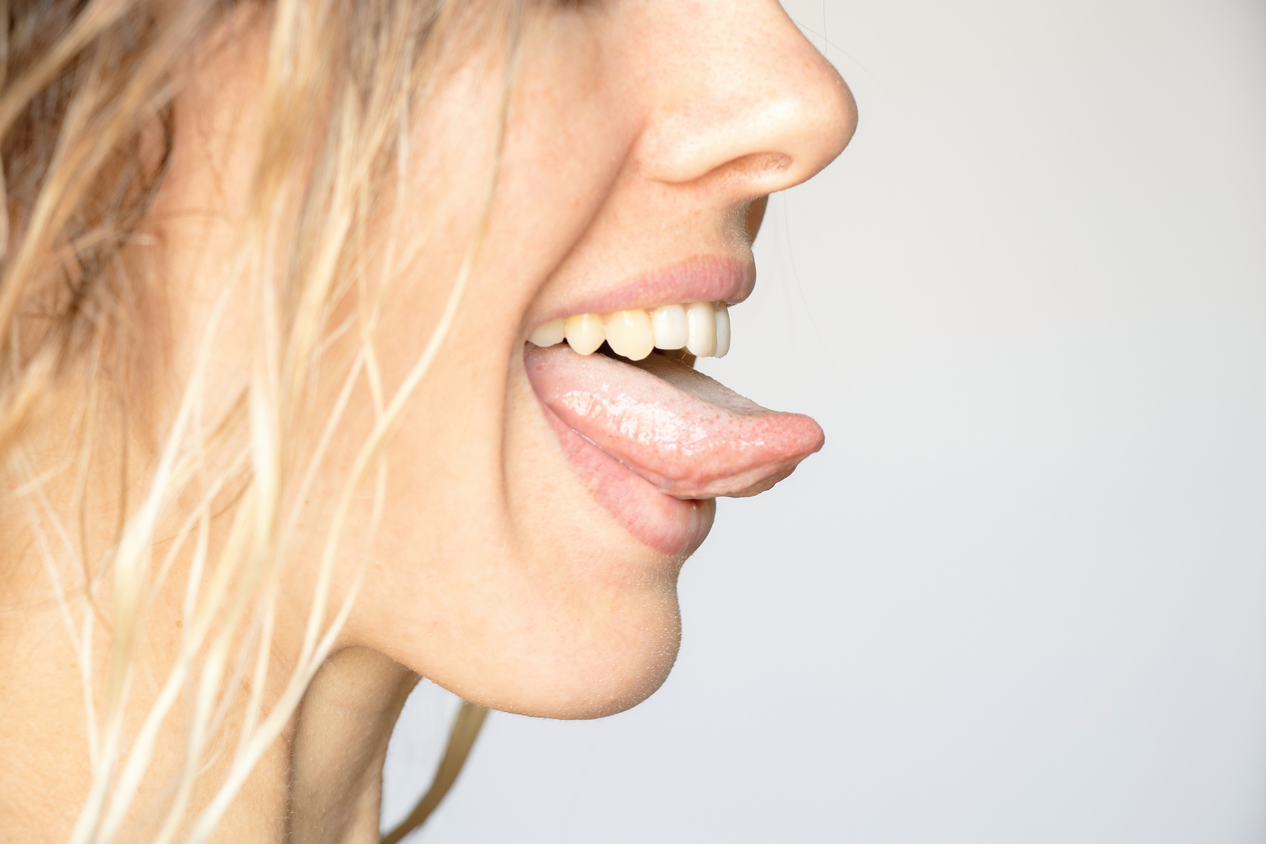 Girl Face with Tongue on White Background, Tongue